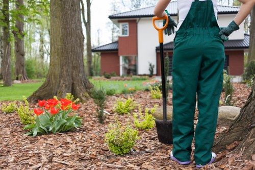 Community volunteers receiving compost and woodchip from a local lawn care service